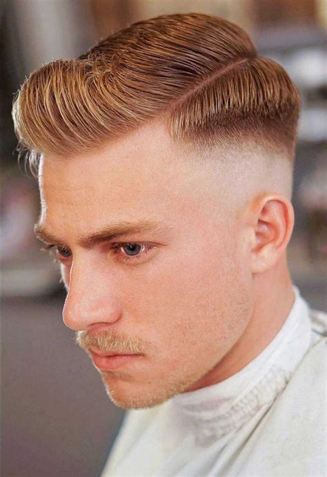 Fade Hard Part Haircut Feel awesome with a bold, edgy view that combines a low to mid fade with a hard part. . Hard part fade